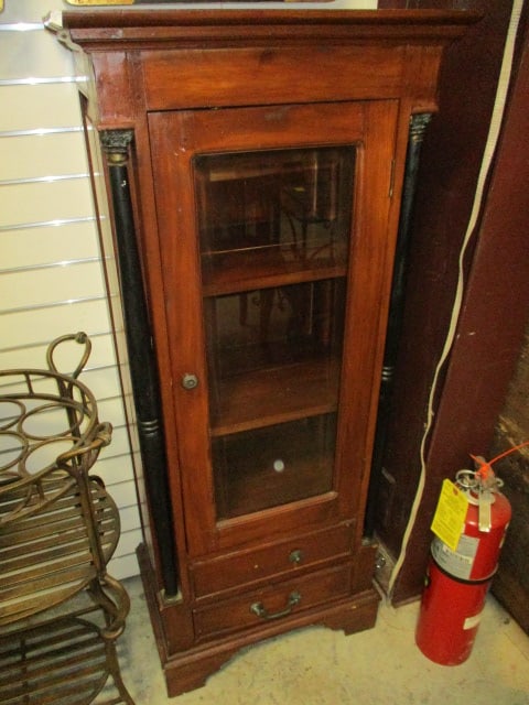 Mahogany Empire Influence Display Cabinet with Painted Black Turned Columns: Single Glass Door with Two Drawers, 21" x 14" x 49 1/4", Drawers have swan neck bail handles(one drawer missing pull), two fixed shelves(one shelf has split), some nicks and scratches, left column nee