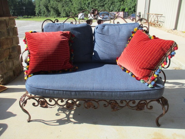 Ornate Wrought Iron Mediterranean Tuscan Style Settee with Upholstered Seat/Back Cushions: and Pair of Tassel Trim Velour Throw Pillows. High back curled arms with ornate scrollwork and petaled flower adornments. 55" long, one seat cushion tie needs reattaching, Local Pickup Only