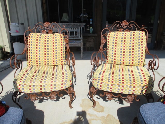 Pair of Ornate Wrought Iron Mediterranean Tuscan Style Chairs with Upholstered Seat/Back Cushions: High back curled arms with ornate scrollwork and petaled flower adornments. 31"w, one seat cushion has small hole and one back cushion has spot, Local Pickup Only