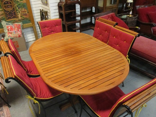 Rausch Gallery Indonesian Teak and Black Metal Indoor/Outdoor Dining Set: Oval Slatted Teak Table and Six Half Round Slat Side Chairs with Rolled Seat Front and Top Rail. Table 65"(with 21 1/2"w leaf installed) x 43" x 28 1/2", (6)20"w Side chairs with Removable Cushions,