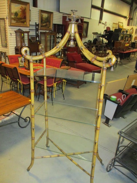 Vintage Chinoiserie Pagoda Style Faux Bamboo Etagere with Glass Shelves: 4" x 21" x 74", three glass shelves, brass casters, some finish scuffs, Local Pickup Only