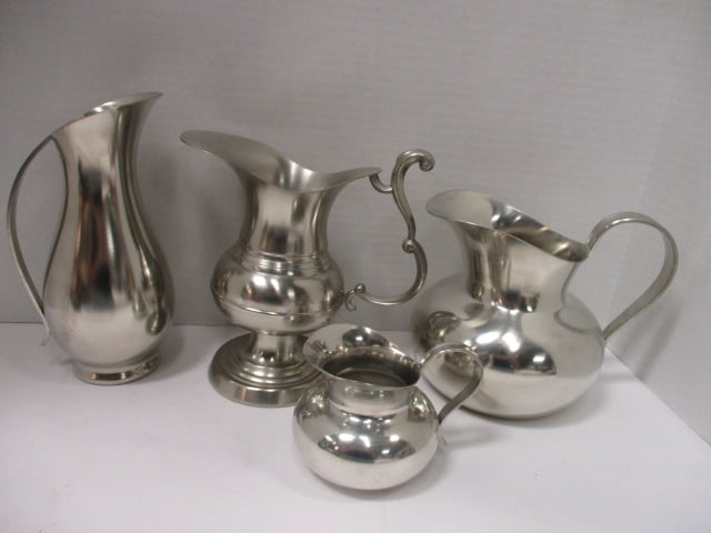Pewter Pitchers and Creamer: .