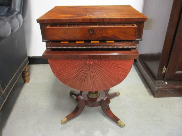 19th Century Regency Style Mahogany Sewing and Games Table: Work Bag and Checkerboard Gaming Table with Scrolled Brass Caster Feet and Lyre Form Support Pedestal Base. Sewing/Work Bag with Pleated Fabric Covering. Sliding Game Board Has Inlaid Wood