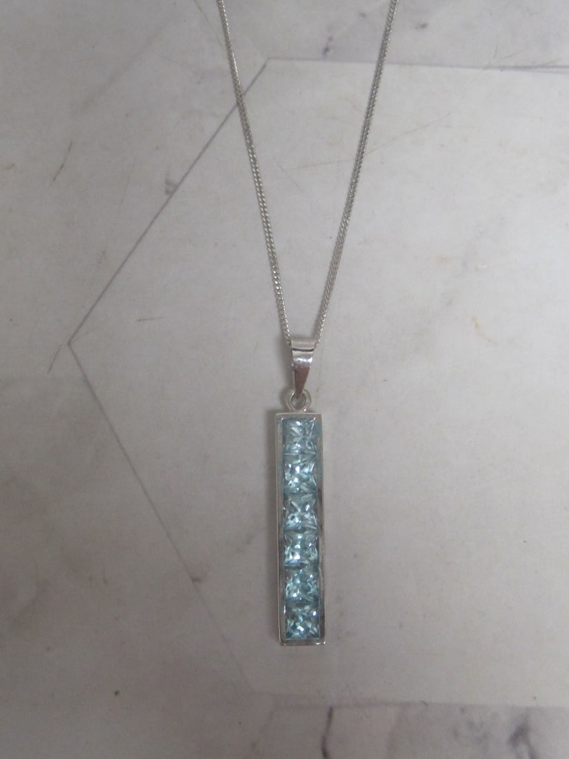 18k White Gold Blue Topaz Pendant on 16" 18k Gold Chain: Weighs 3.7 grams