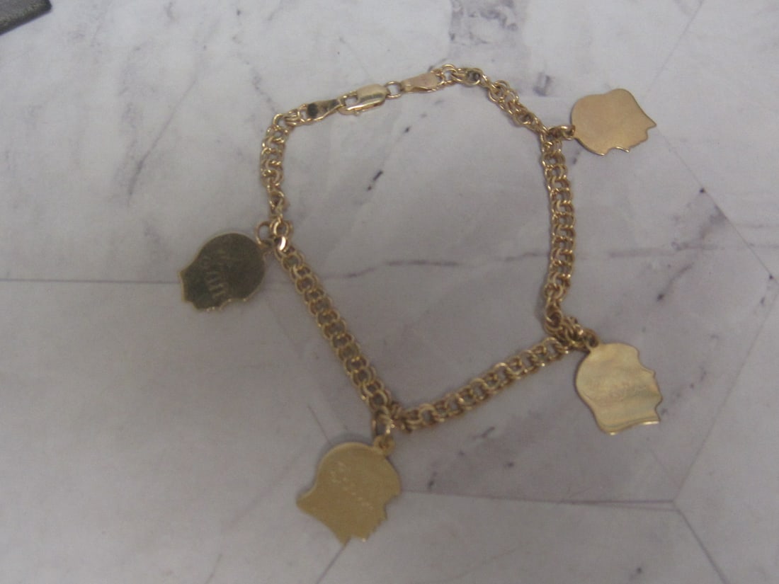 8" 14k Gold Charm Bracelet with 4 14k Gold Head Charms: Weighs 7.4 grams, Engraved