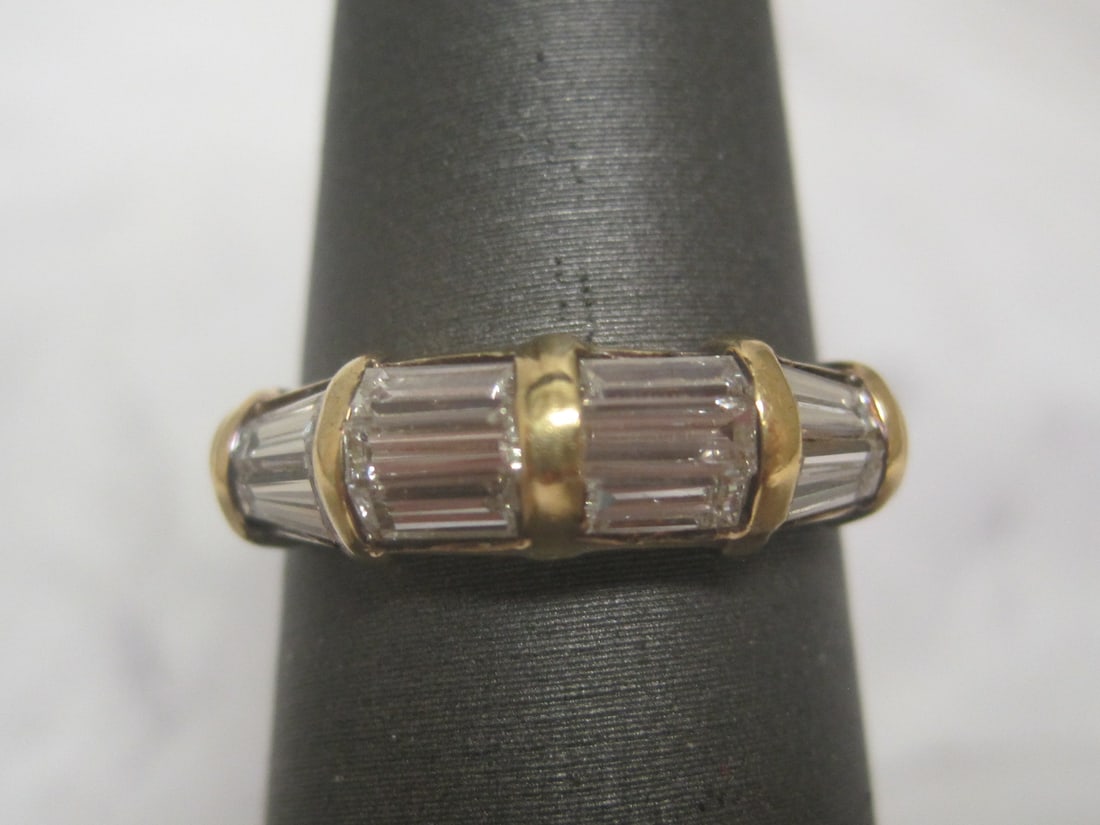 18k Gold Diamond Band appraised at $3000: Weighs 3.3 grams, Size 6 1/4, 10 baguette shape diamonds totaling 1 carat, high grade. See picture of appraisal for additional info.
