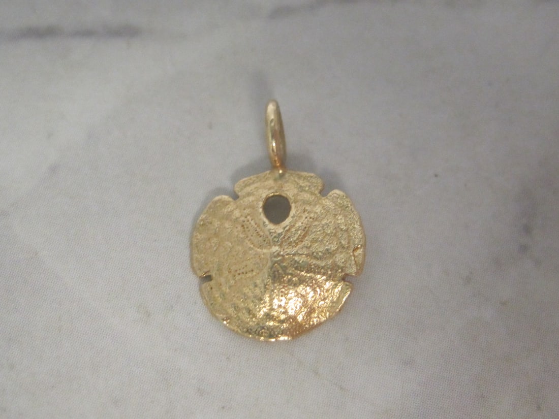 14k Gold Sand Dollar Charm: Weighs 0.4 gram