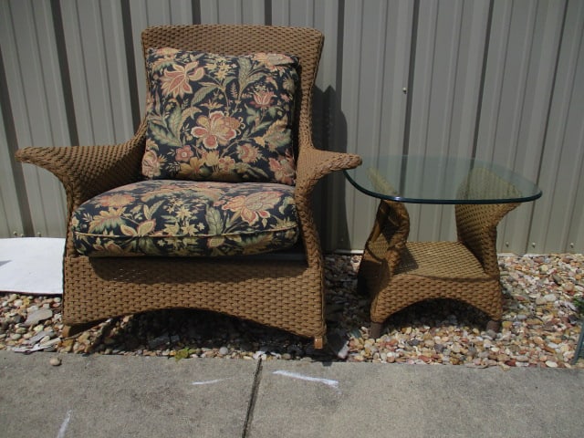 Lloyd Loom Woven Resing Indoor/Outdoor Flared Arm Rocker and Glass Top Side Table: Both have removable cushions, Rocker 38"w, table 24" x 24" x 20 1/2", cushions have some UV light fading and weathering, Local Pickup Only