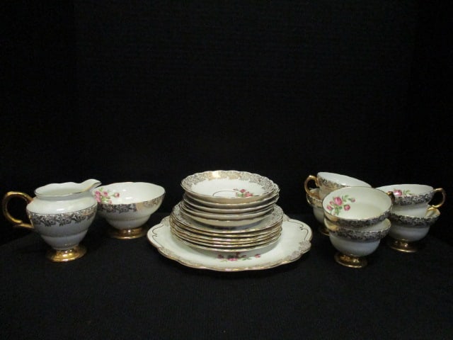 21 Pieces of Rosina Bone China Tea & Biscuit Set: (1)9 3/4" tab handle tray, (6)6 1/2" plates, (6)5 1/4" saucers, (6)2 1/2"h cups, (1)4"h creamer and (1)2 1/2" open sugar bowl