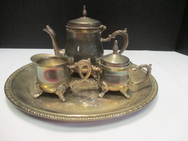 International Silver Co. Children's Silverplated Coffee Service: Coffee pot 5"h, creamer 2 1/4"h, sugar bowl 3 1/4"h, tray 9 3/4"dia