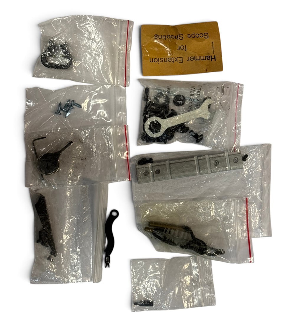 Lot of Spare Gun Parts: (1)replacement iron sights | (1) Barrel Brush | (1) bag of assorted screws and small wrench | (1) replacement top rail | (1) detent plunger | (1) Hammer Extension for Scope Shooting | (1) bag of screw