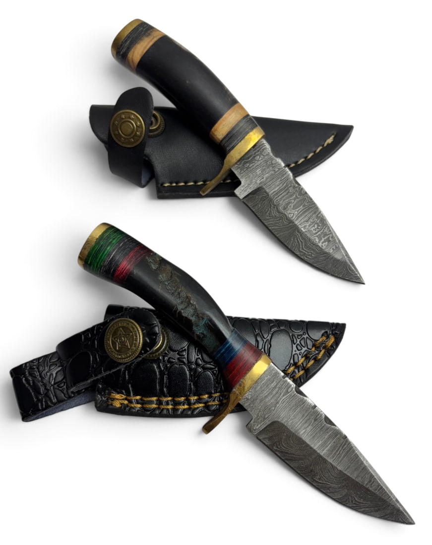 (2) Handmade Damascus Steel Knives with Custom Wood/Resin Grips and Leather Sheathe: Handmade Damascus Steel Knives with Custom Wood, Bone, Horn, or Resin handles. The Blade on these knives is a combination of 1095 HC Steel 15N20 Nickel Carbon Steel. The Laminate Bar is then folded