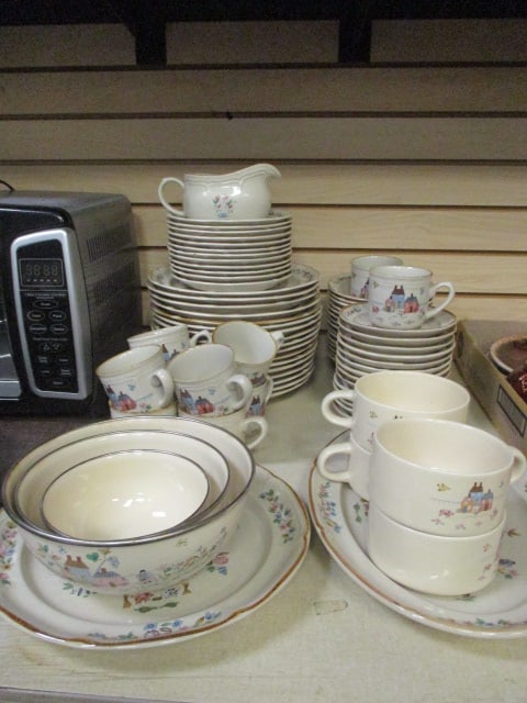 Pieces of Vintage International Tableworks "Heartland Village" Stoneware: (17) 10 3/4 plate, (12) 7 3/4" plate, (15) 7" bowl, (14) 6 1/4" saucer, (10) 3 1/8" cup, (4) 4 5/8" x 2 3/4" soup cup, (1) 7" x 3 3/4" gravy boat, (1) 12 1/4" round platter, (1) 14" oval platter, and