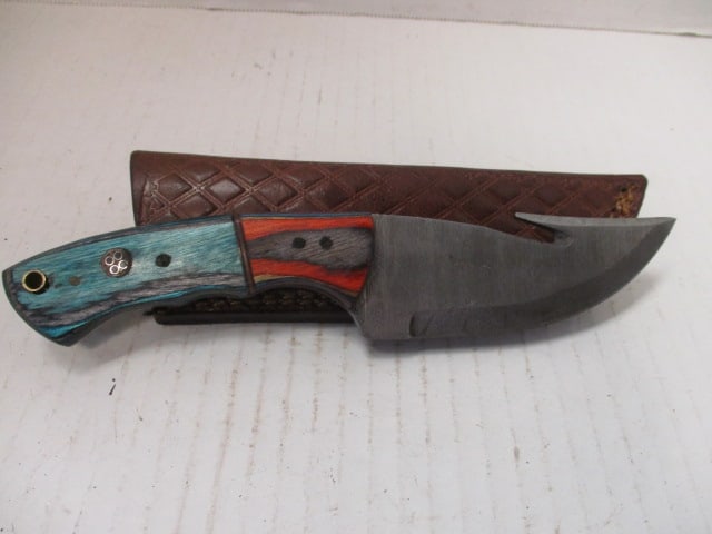 Damascus Steel Fixed Blade with Gut Hook & Two-Tone Wood Handle: No rust noted.