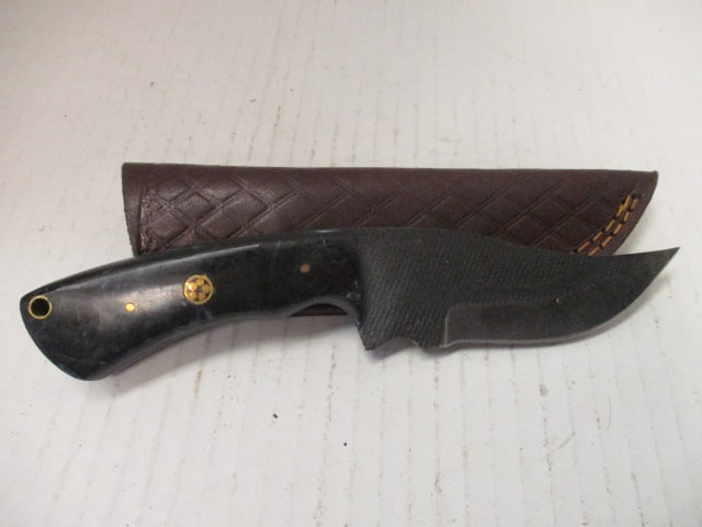 Textured Curved Fixed Blade with Resin Handle: No rust noted.