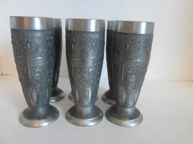 Six Vintage German Pewter Embossed Pastoral/Hunting Scene and Scrollwork Pilsner Beakers: 6 3/8"h, has German maker's mark on bottom, nicks/dings on rims