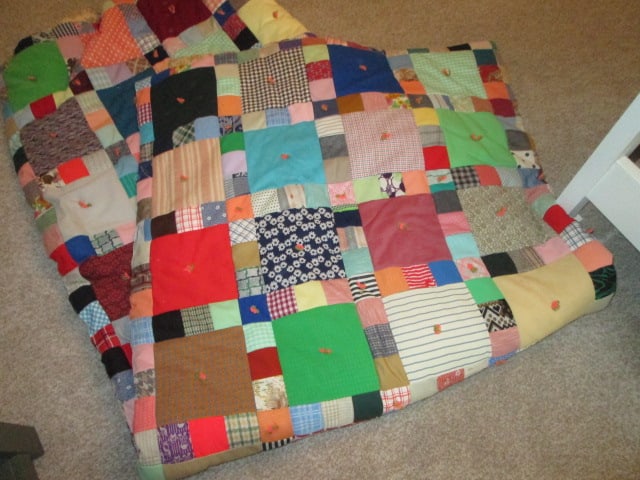 Vintage Hand Sewn Polyester Pieced Scrap Quilt: approx. 80" x 96", has floral cotton backing