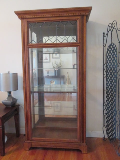 Traditional Illuminated Oak Side Entry Curio Cabinet with Leaded Glass Front: 39 1/2" x 18 1/2" x 77", Mirrored Back, Four adjustable glass shelves, each side has two push release glass doors, dentil crown molding, Style #C214-42, Local Pickup Only