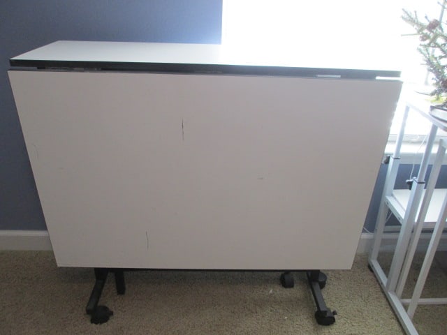 White Laminate Portable Gate Leg Work Table: 59 1/2"(sides up)13 1/4"(sides down) x 36" x 34 1/2", missing one caster and one falls off, Local Pickup Only