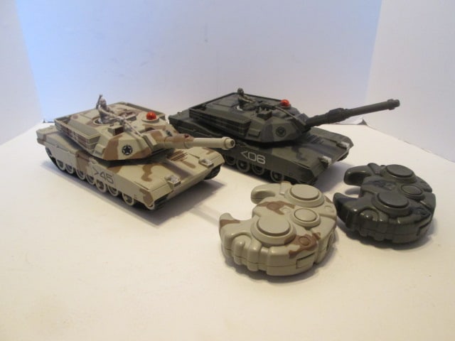 Two 2001 Interactive Toy Concepts Remote Controlled Toy Military Tanks: approx. 13" long to tip of muzzle, battery were left in toys during storage-some corrasion-see pictures and preview(untested)
