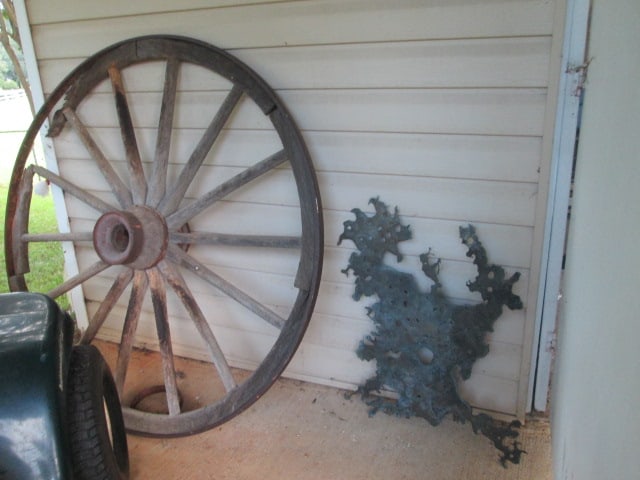 Antique Steel Tire Wooden Spoke Wagon Wheel and Metal Pierced Splatter Wall Art: Wheel approx. 48"dia, wheel has age and weathering damage-see pictures and preview, Local Pickup Only