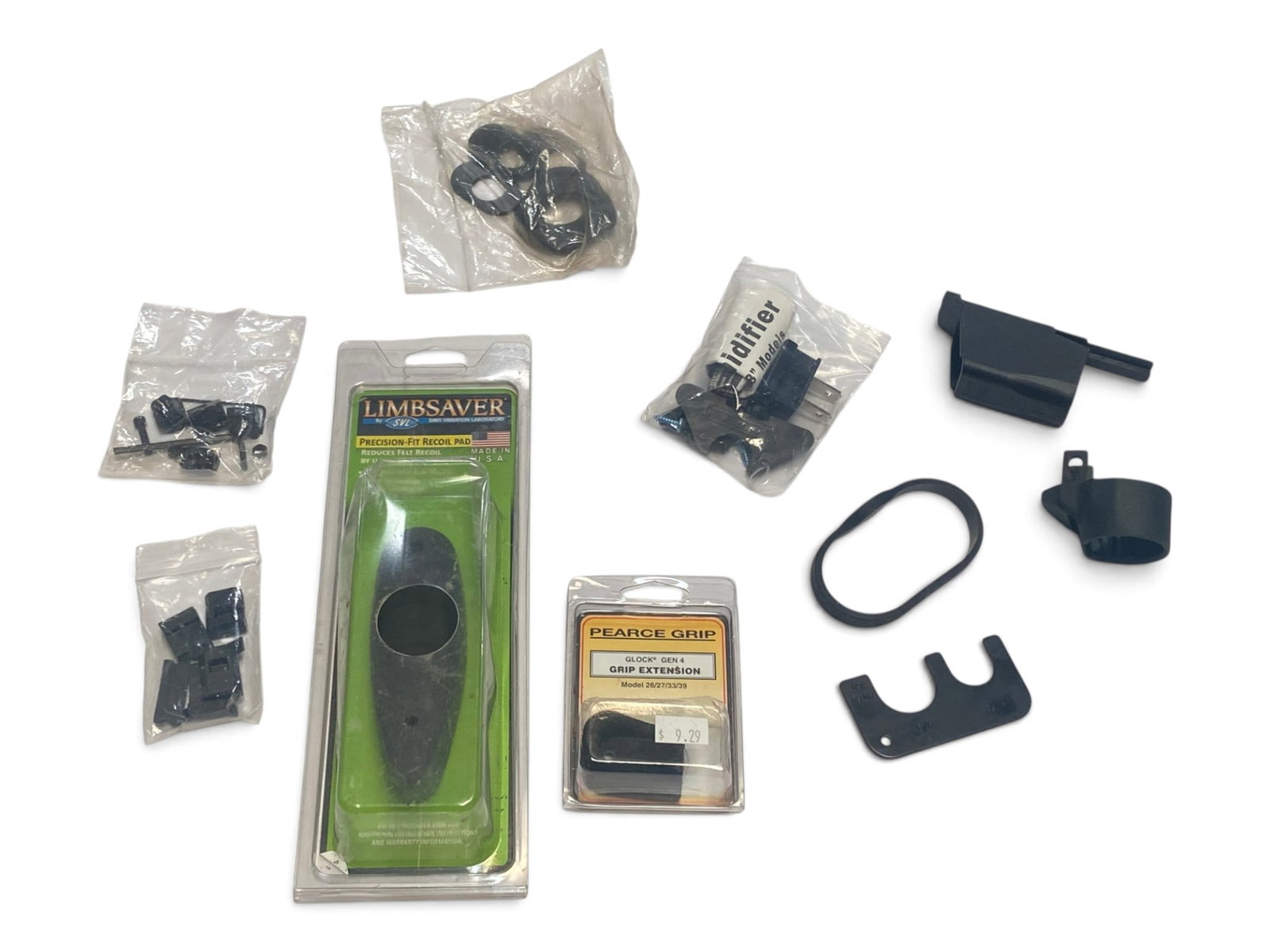 Gun Accessory Lot & Buttpad for Lot 99 Tikka Rifle: See photos for what’s all here. Takeoff Buttpad from a Tikka Rifle, Specifically Lot number 99 in this auction. Also included are beretta 9mm magazine loader, and some shotgun parts.
