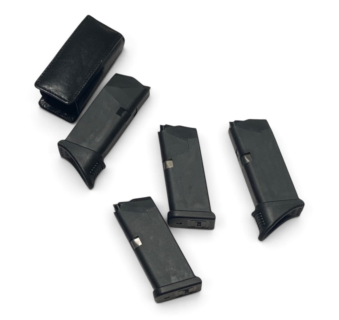 (4) Glock Magazines: One comes with nice leather magazine pouch
