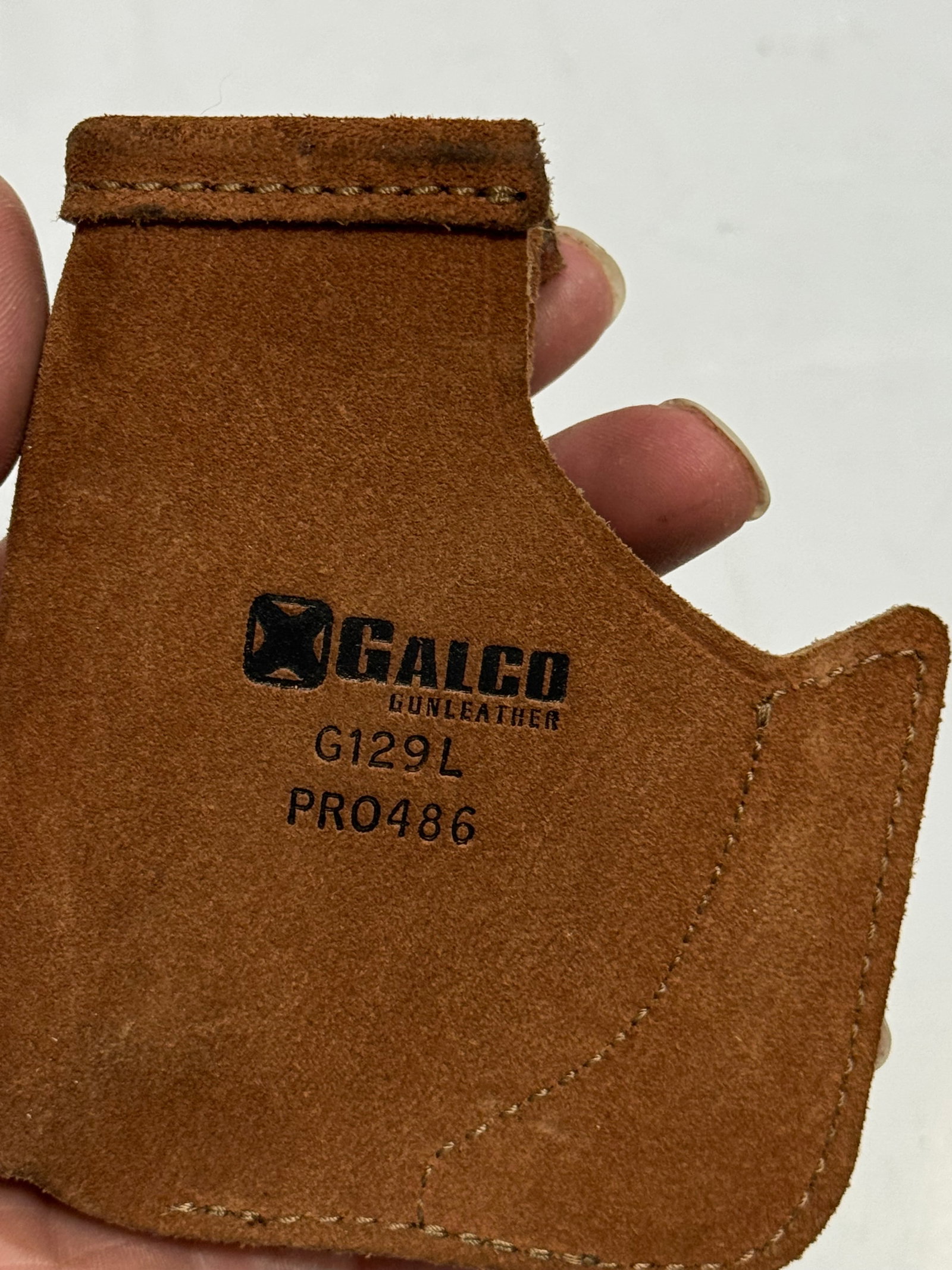 (4) Holsters and (1) Magazine Holder - 4