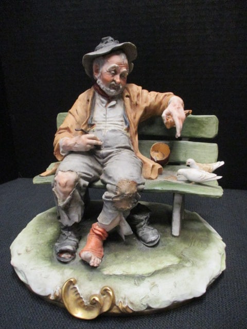 Capodimonte by Artist Bruno Merli Sculpture (man on bench): 9 1/2 x 6 1/2 x 8