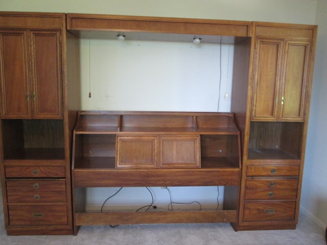 Bassett Illuminated Oak Queen Bed Modular Unit with Metal Frame: Unit includes pair of nightstand armoires, illuminated bridge and headboard with sliding door storage. (2)24" x 18" x 78" Nightstand armoires with upper doors, open storage, three drawers and pullout 