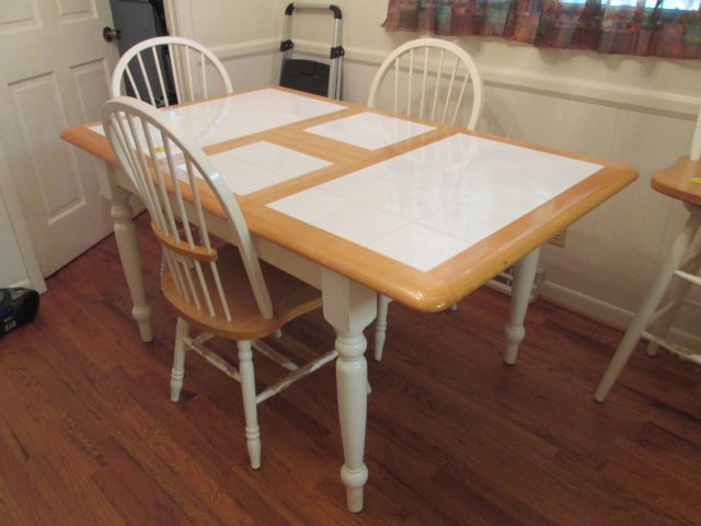 America 2 Tone Natural Maple and White Ceramic Tile Top Dining Table Set: Table including 15 1/4" butterfly leaf measures 60" x 36" x 30", Table without leaf open 45" x 36" x 30", (3)17 1/2" spindle back side chairs, chairs have pet damage on legs-see pictures and preview