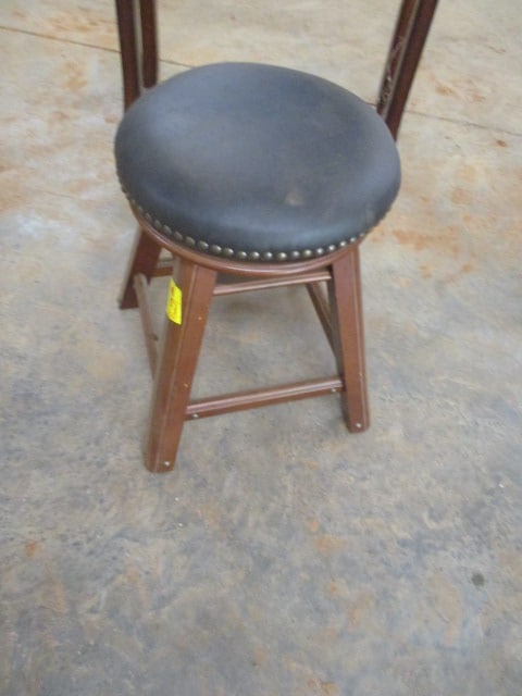 The Bombay Co. Black Leatherette Swiveling Piano/Organ Stool with Nailheads: 18"dia, adjustable height, has been stored in warehouse and needs wiping down, Local Pickup Only