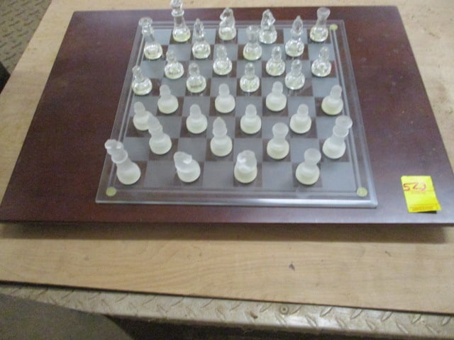 The Bombay Co. Glass Chess Set on Lazy Susan Base: 23" x 16 1/2", set appears complete, has been stored in warehouse and needs wiping down, Local Pickup Only
