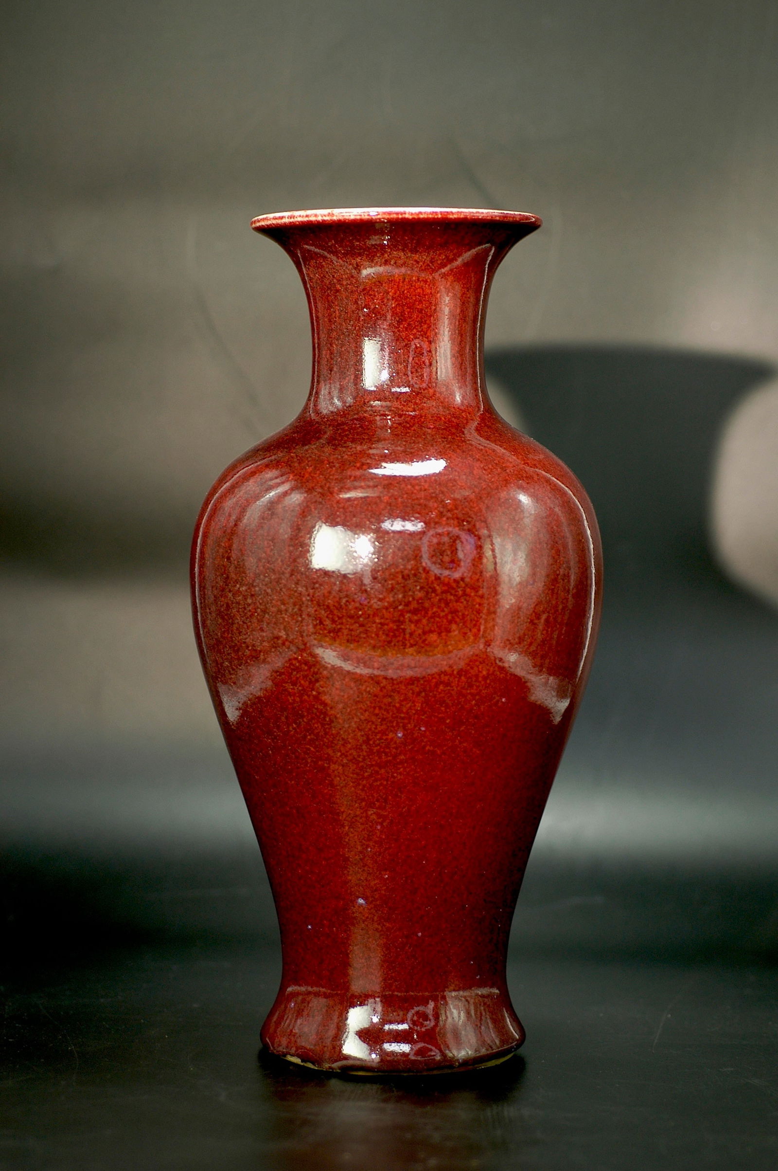 Qing Dynasty Sang-de-Boeuf Glaze Guanyin Vase: H34.5cm x W15.5cm. Period: Qing Guangxu period (late 19th century, imitating Kangxi Lang kiln red style, folk kiln fine ware). Glaze Type: Lang kiln red glaze (high-fired copper red), with typical 'la