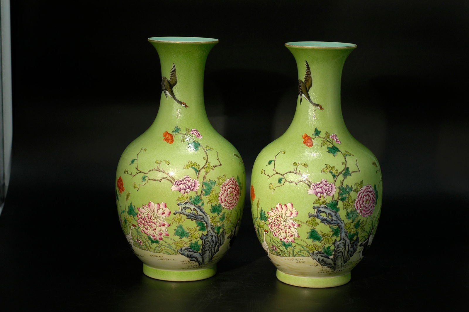 Qing Dynasty Famille Rose Bird-and-Flower on Green Sgraffito Ground Appreciation Vase, a Pair: H29CM W14CM. Qing Qianlong green ground gilt decorated famille rose vase with bird and flower motifs (pair). White porcelain body with famille rose and gilt decoration. Qing Qianlong imperial kiln (or