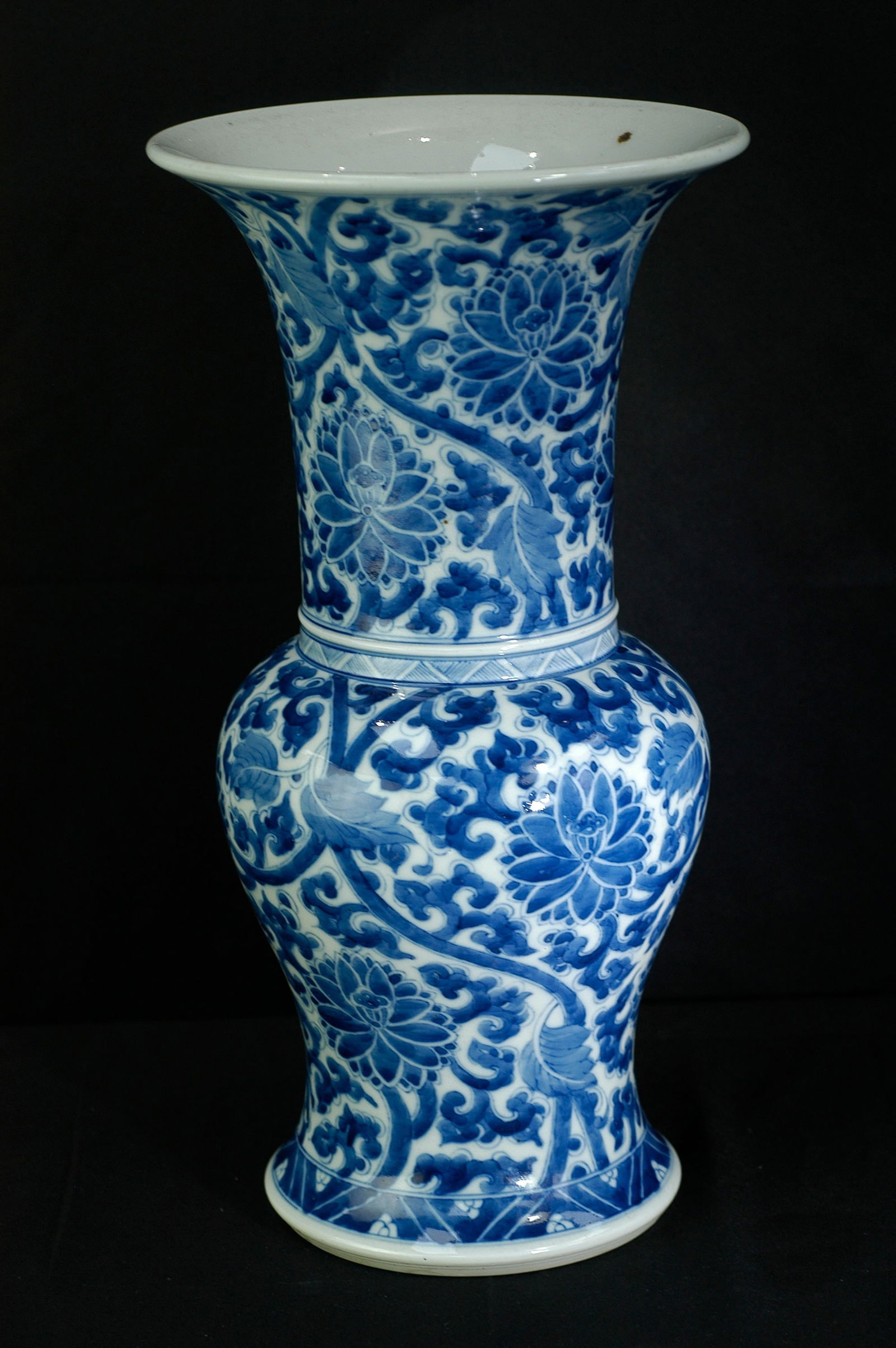 Qing Dynasty Blue and White Scrolling Lotus Phoenix-Tail Zun (Flower Gu): H36cm W18.9cm. Qing Kangxi period blue and white display porcelain, typical phoenix-tail zun (gu-form vase) with flared mouth, long neck, bulbous body, and splayed foot, named for the phoenix tail-lik