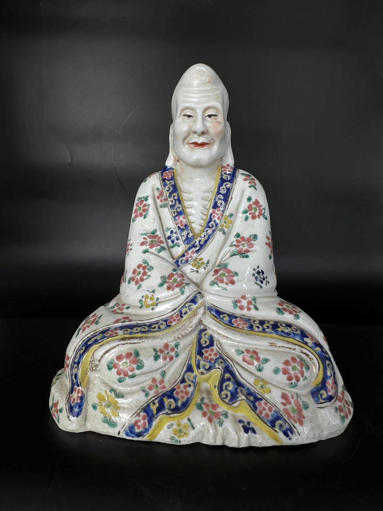 Qing Dynasty Fujian Guild Hall Mark Ruan Jingkai Famille Rose Luohan Seated Figure: H22cm W17cm Famille-Rose Seated Figure of a Long-Eyebrowed Luohan, Marked "Made by Ruan Jing". Jingdezhen white porcelain with famille-rose enamels (overglaze decoration). Republic period (Fujian Guil