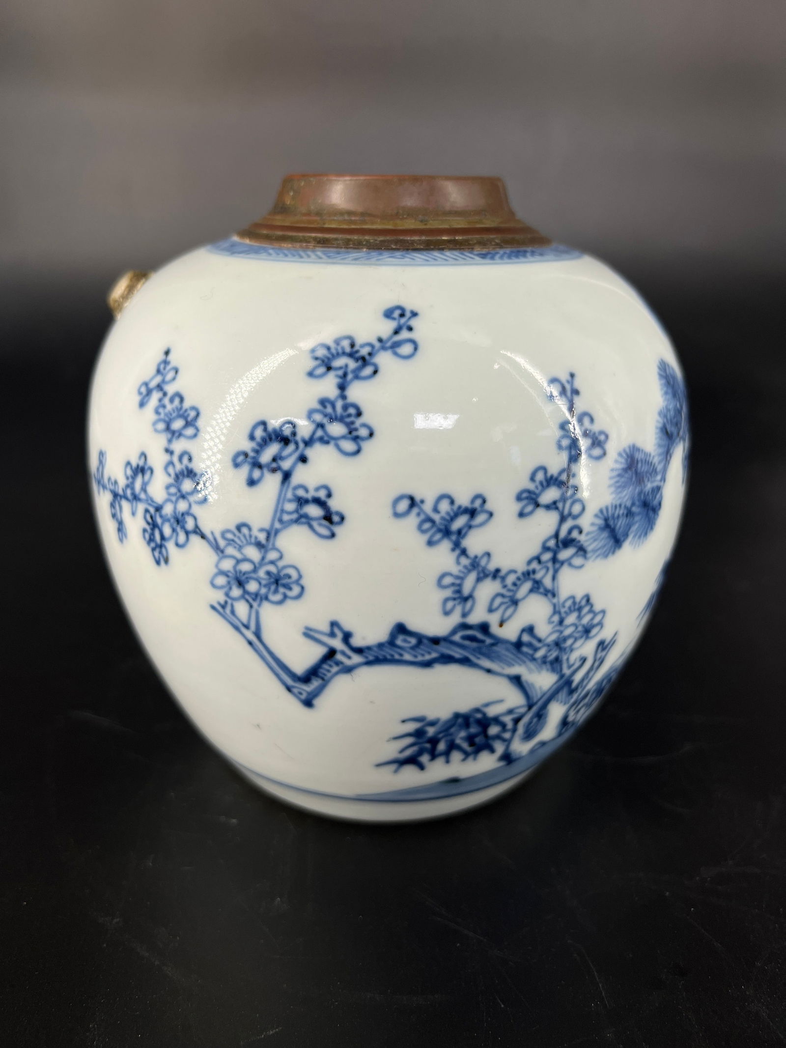 Qing Dynasty Blue and White Three Friends of Winter Jar: H:14cm W:12.5cm Blue-and-White Jar with Pine, Bamboo, and Plum ("Three Friends of Winter") Motif, Later Fitted with Copper Spout. Jingdezhen blue-and-white porcelain with purple-copper spout. Mid-late