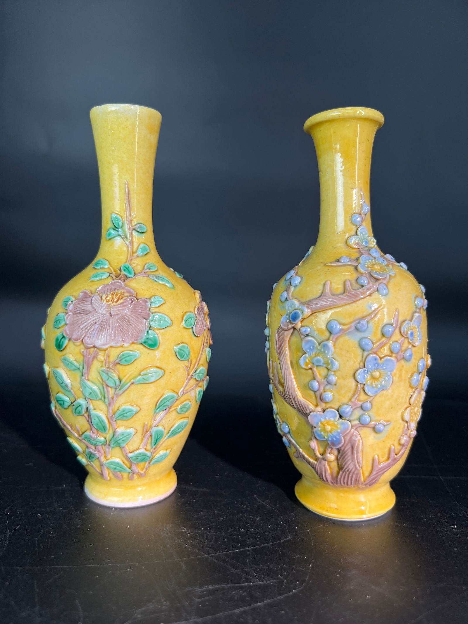 Republic Period Yellow Glaze Molded Floral Small Vase, a Pair: H13.2CM W5.3CM Pair of Republic period yellow-glazed carved porcelain small vases with floral decoration (also known as export yellow-glazed applied floral gallbladder-form vases). Material: Jingdezhe
