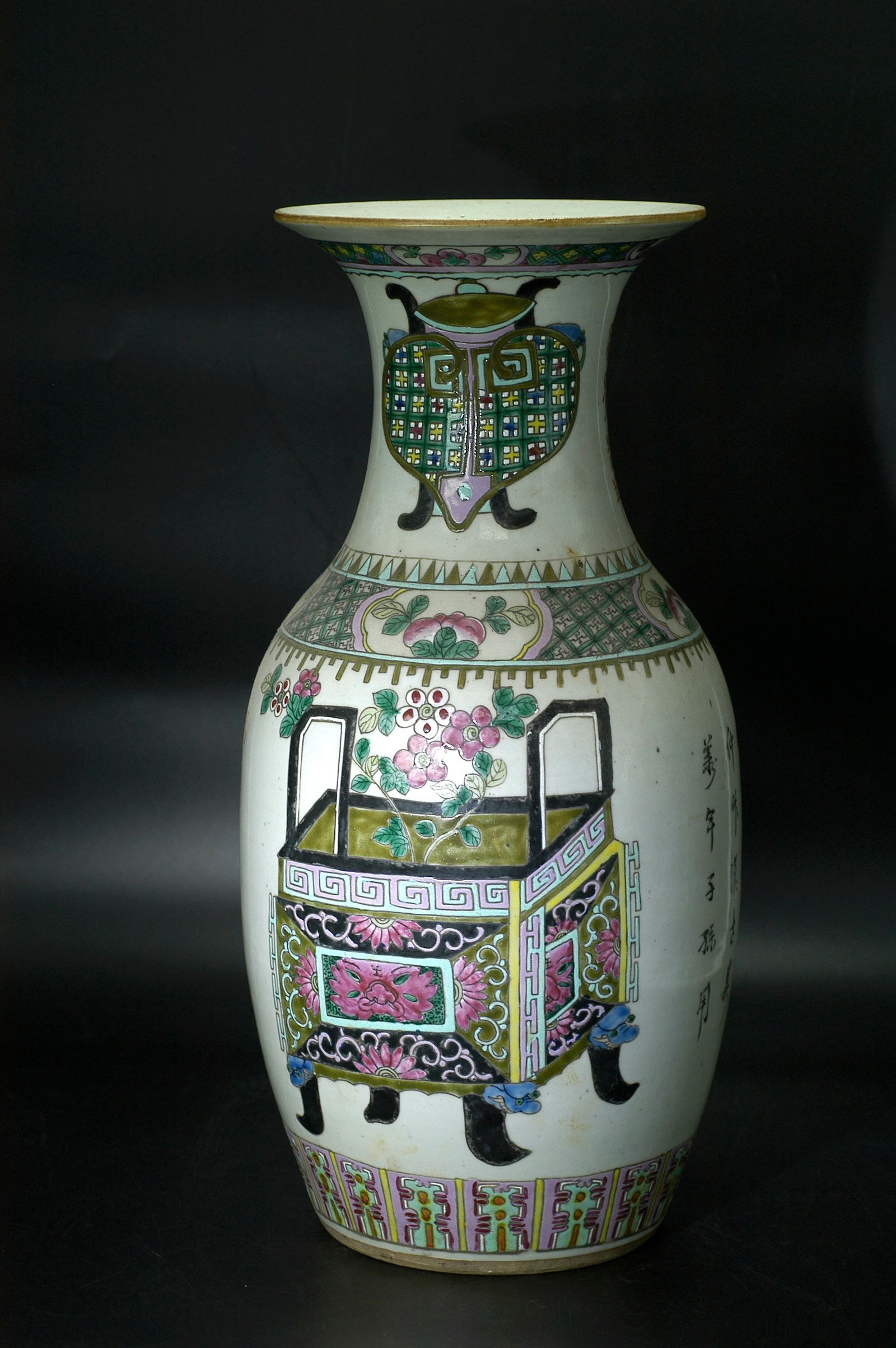 Republic Period Antiquarian Floral Shou Character Dish-Mouth Vase: H:43CM W:20CM Famille-rose vase with 'antiques' (bogu) motif and everted rim, bearing apocryphal 'Tongzhi Nian Zhi' mark, later converted into table lamp. Jingdezhen white porcelain body with famille-
