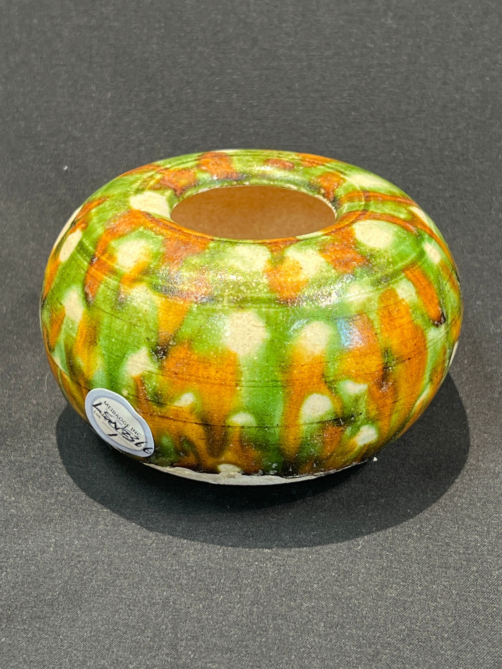 Tang Dynasty Sancai Water Pot (Scholar's Water Vessel): H6.3CM W9.5CM. Tang Dynasty - Sancai Water Vessel (Scholar's Water Pot). Essential Features: Form: Flattened globular shape with small inward mouth and flat-cut base, fine pale yellow body clay. Glaze