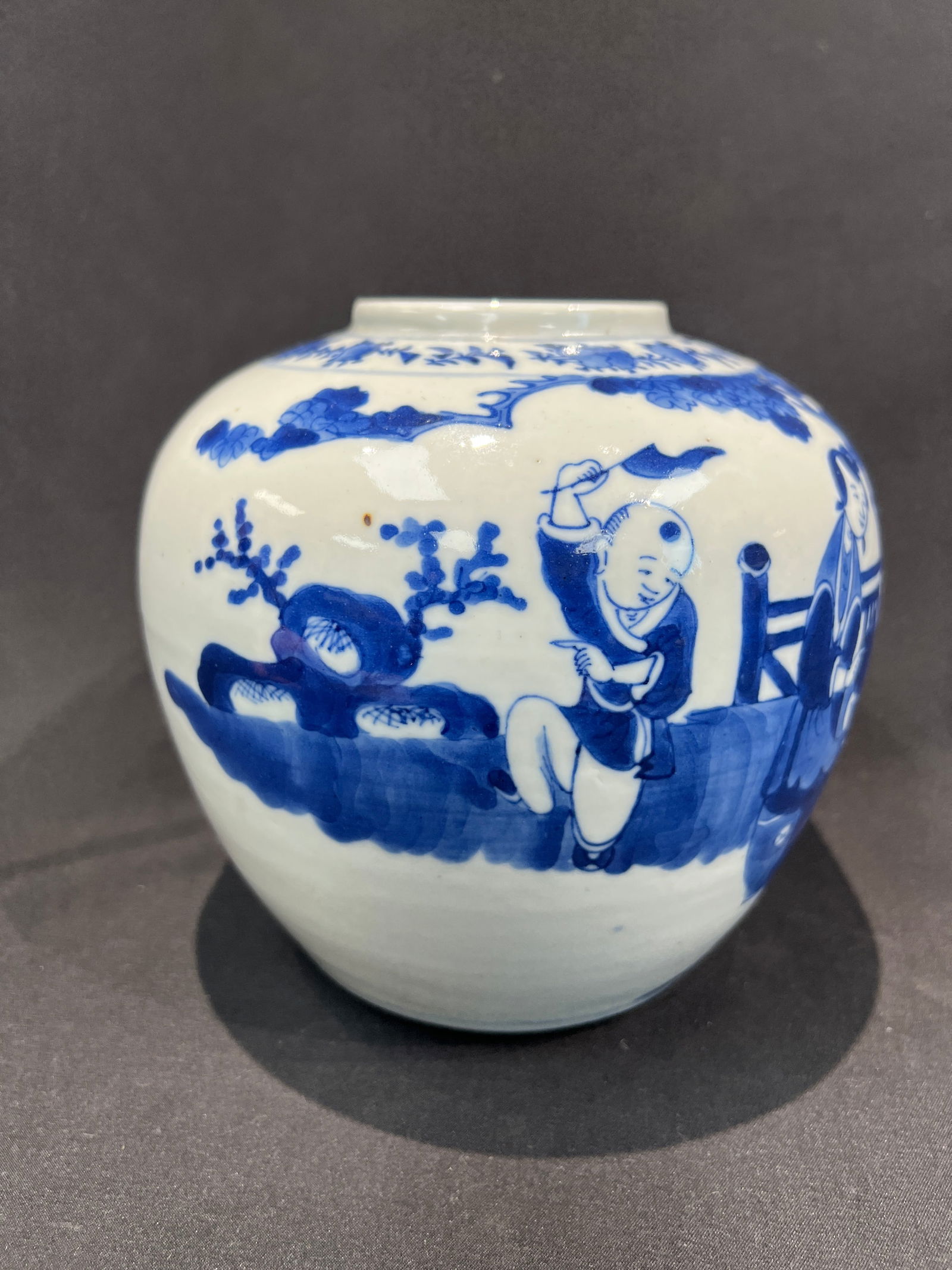 Qing Dynasty Blue and White Boys at Play Jar: H16cm W14.5cm Blue and White Jar with Children at Play. Period: Mid-Qing Dynasty (Daoguang-Guangxu). Material: White ground blue and white porcelain. Craftsmanship: Continuous scene depicting children
