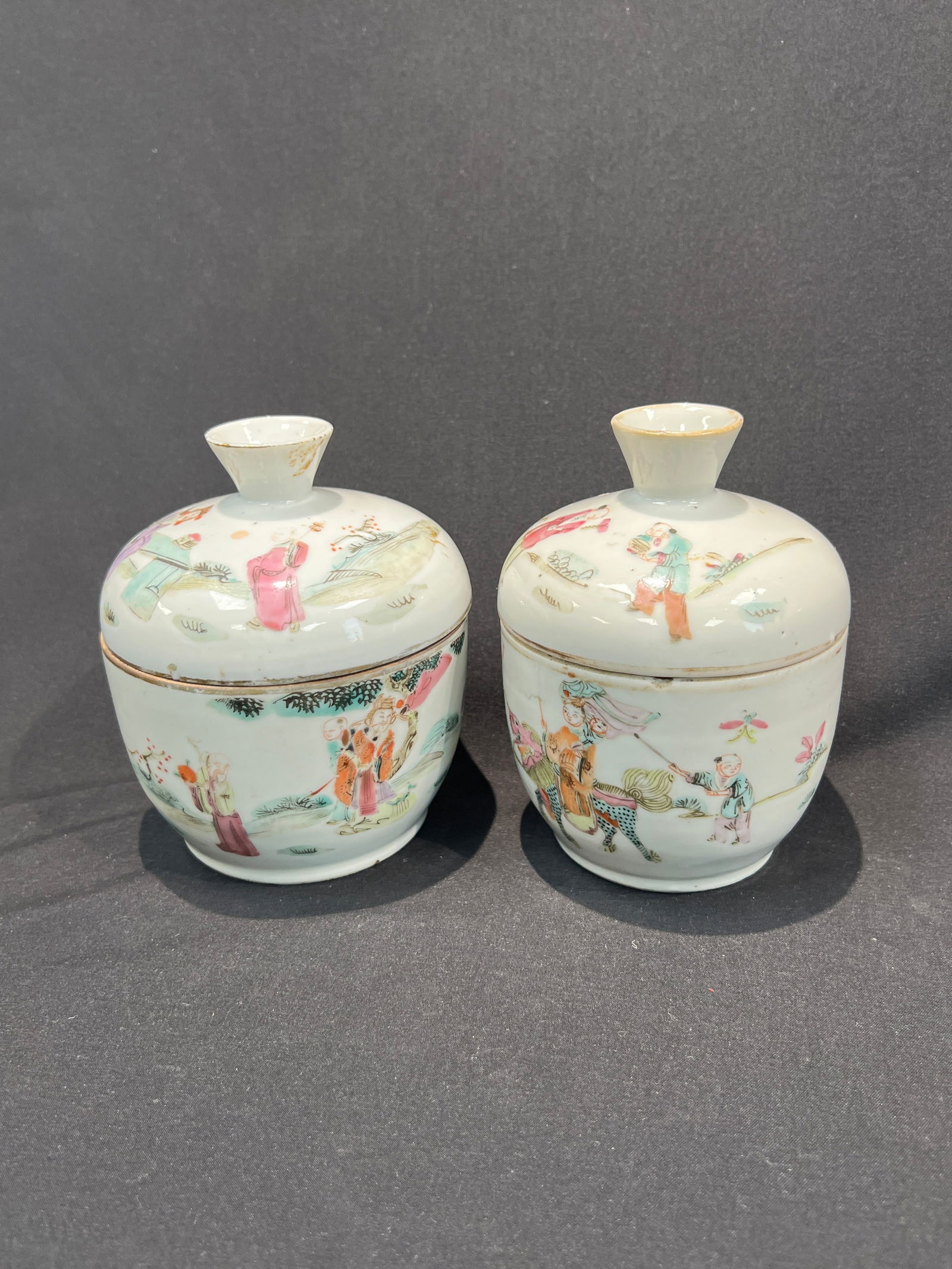 Famille Rose Qilin Sending Son / Figures Covered Bowl, a Pair: H12cm W10.5cm 2H12.5cm W9.5cm Pair of Famille Rose Covered Bowls with Qilin Presenting Child and Figural Scenes. Period: Late Qing Dynasty (Tongzhi-Guangxu). Material: White porcelain body with famill