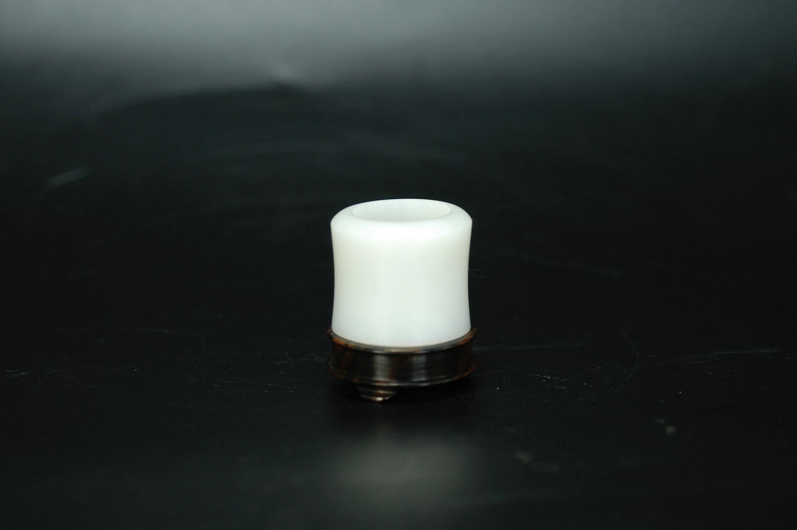 Qing Dynasty Hetian White Jade Archer's Ring with Wooden Stand: H:2.8cm W:3.2cm Mid Qing Dynasty (Qianlong-Jiaqing) Hetian White Jade Waist-Constricted Plain Archer's Ring, from old overseas collection, preserved in complete transmitted condition and accompanied b