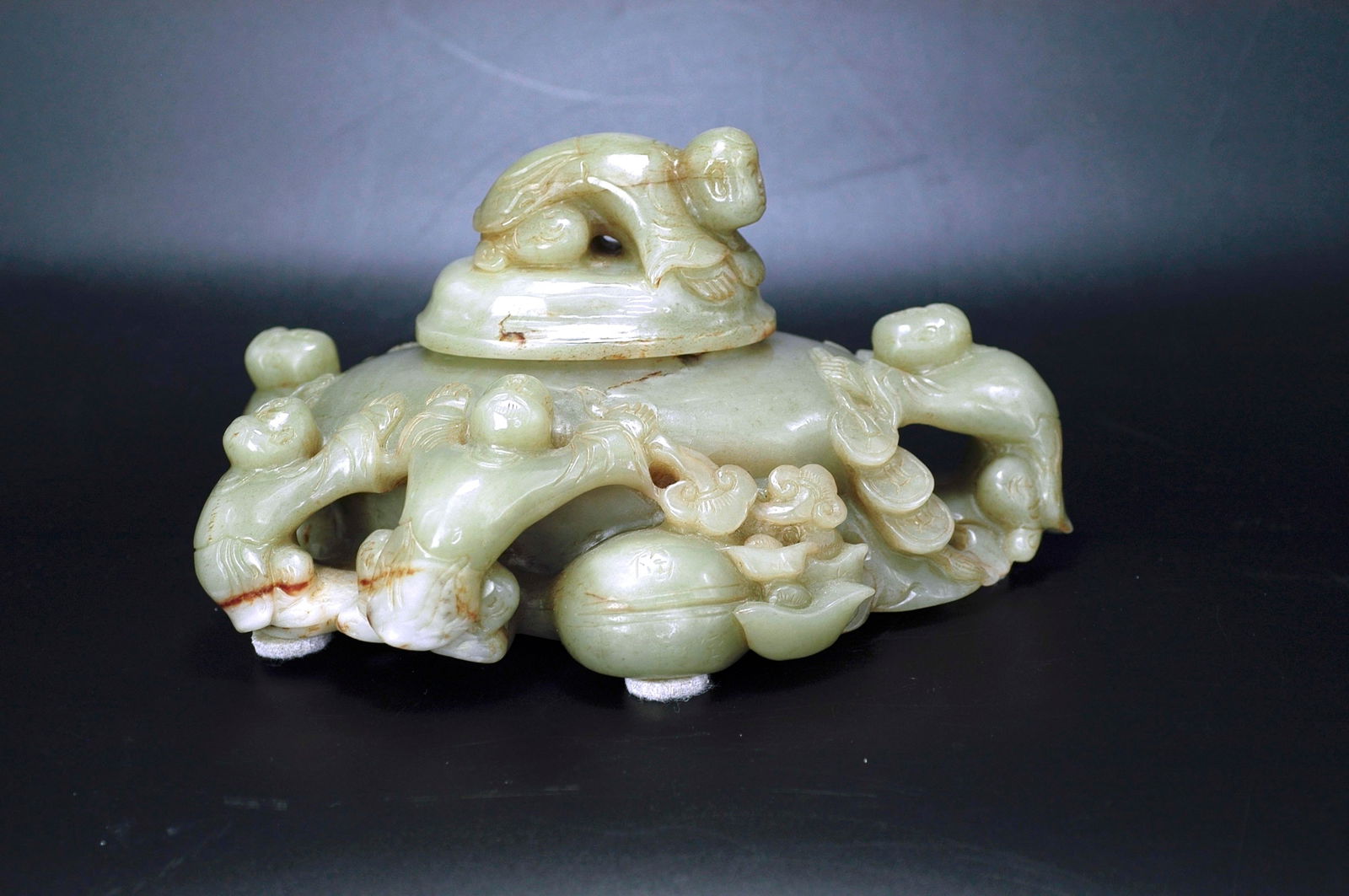Republic Period Hetian Greenish-White Jade Five Sons Passing the Imperial Exam Covered Box: H:11.9cm W:21cm. Designation: Mid Qing Dynasty celadon-white jade covered box with 'Five Sons Achieving Success' motif. Material: Celadon-white jade, warm and fine in texture, of pale bluish-white ton