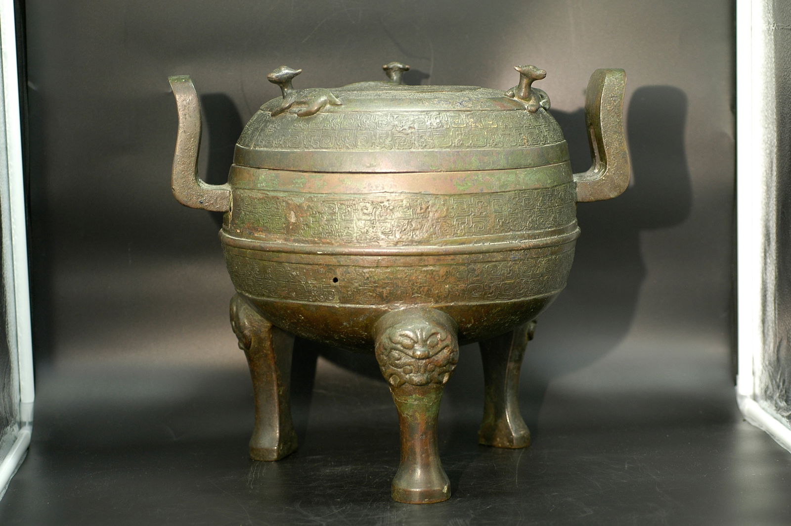 Song Dynasty Archaistic Coiled Snake Beast-Foot Covered Bronze Ding: H36.5cm W44.2cm Spring Period Bronze Ding with inscription interpretation (interior of lid and bottom of vessel). The inscription is in Spring Period bronze script (or Song Dynasty archaic seal script