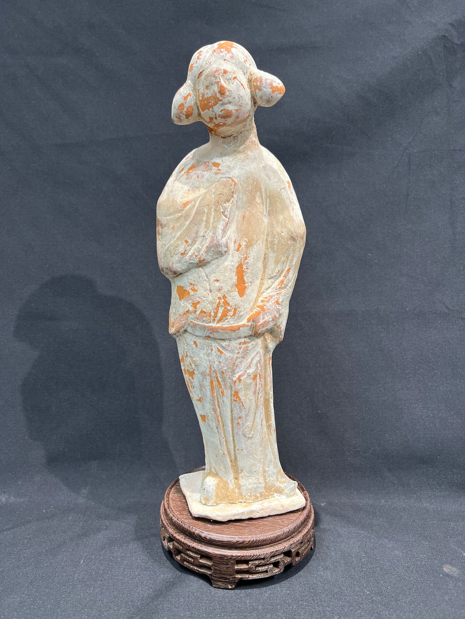 Tang Dynasty White Slip Standing Lady Figure: H:33.5CM W:11CM Tang Dynasty Red Pottery Painted Female Attendant Figure with Double Hanging Buns. Material: Red pottery body with white slip and polychrome decoration, partial pigment loss. Subject: