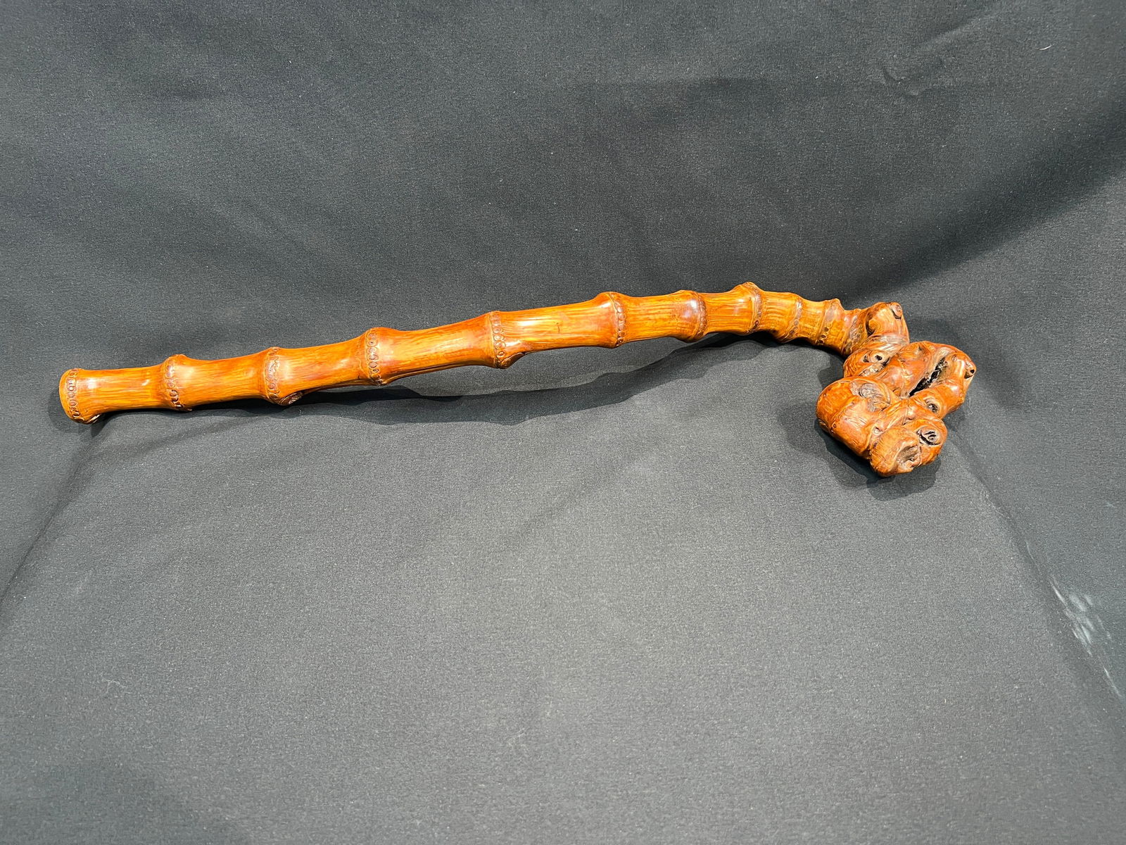 Old Bamboo Root Carved Bamboo-Joint Ruyi Scepter: H4.5cm W54.5cm Old Bamboo Root Carved Ruyi in Bamboo-Joint Form. Period: Mid to late Qing Dynasty through Republic period. Material: Old bamboo root (solid bamboo/luohan bamboo) with warm amber-toned