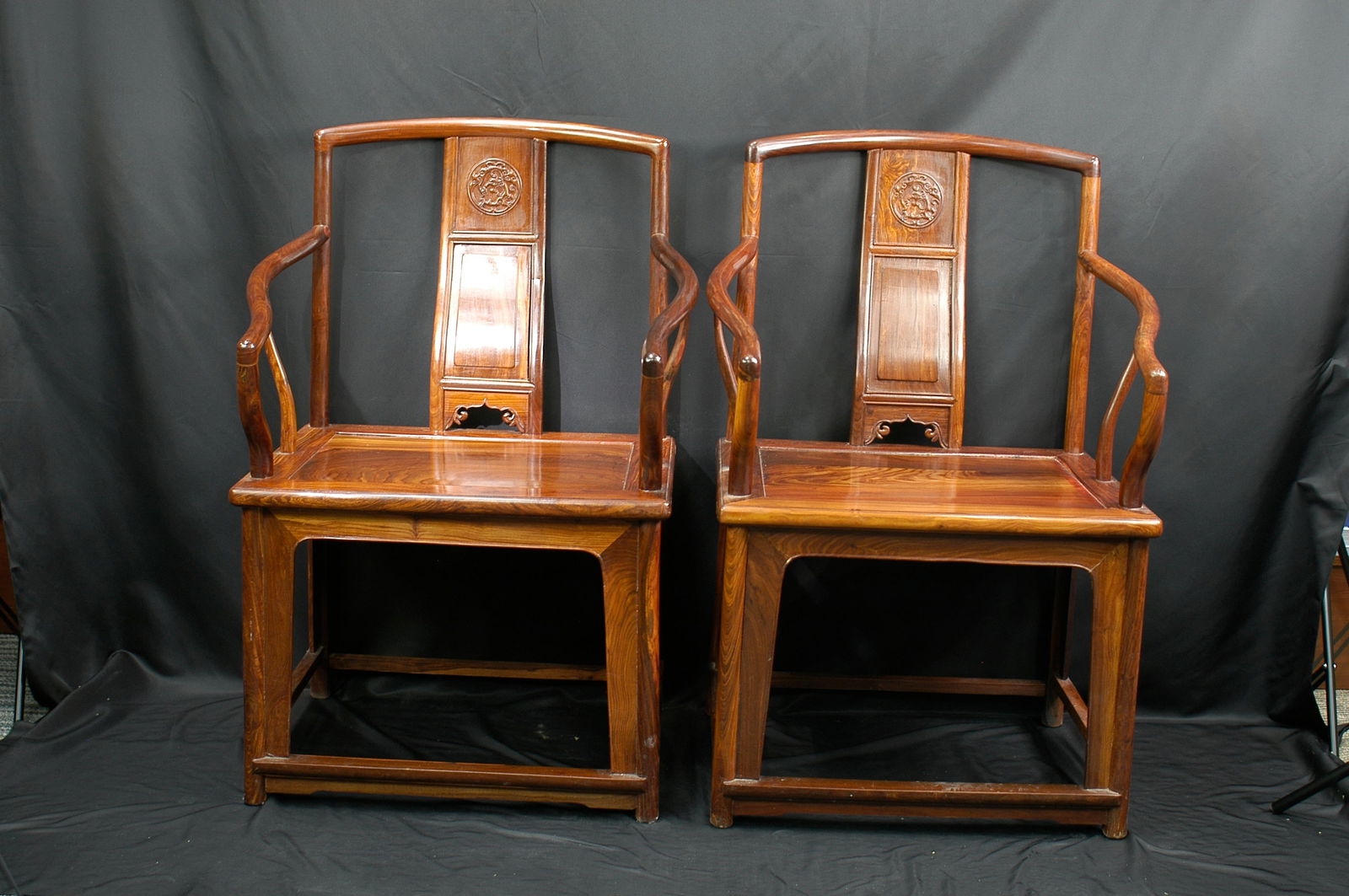 Pair of Ming-Style Rosewood Southern Official’s Hat Chairs: H99cm W67cm This contemporary Ming-style armchair, crafted from modern Huanghuali (Vietnam Scented Rosewood), faithfully recreates the classical "Danao" crest rail and rounded armrests characteristic