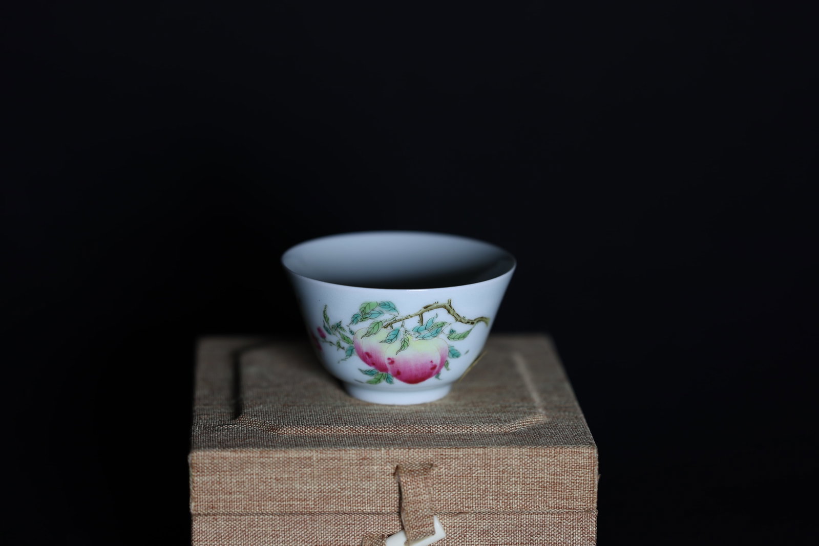 A Famille-Rose 'Peach' Cup, Qianlong Period: Estimated Date: Qianlong Period, Qing Dynasty. An imperial-style Famille Rose longevity cup bearing the Qianlong reign mark.Attribution: The cup is finely potted in translucent white porcelain and dec